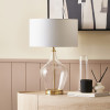 Rowen Clear Bottle Shaped Glass and Champagne Metal Table Lamp